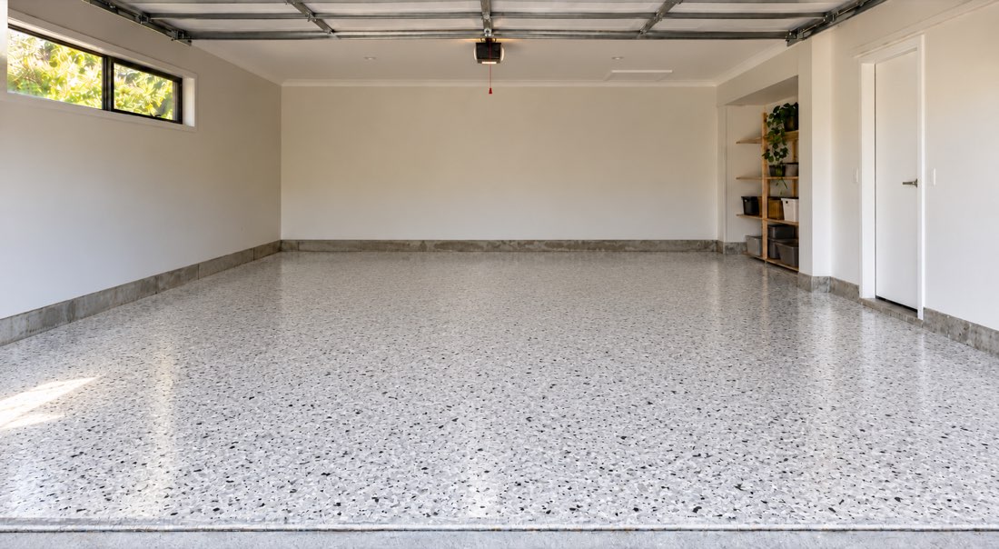 Concept garage with a clean grey and white decorative epoxy flake floor
